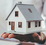 house-model-with-real-estate-agent-customer-discussing-contract-buy-house Buy House in Middletown NJ